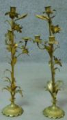 A pair of antique French gilded brass lily candelabras. H.52cm