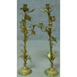 A pair of antique French gilded brass lily candelabras. H.52cm