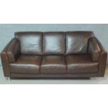 A contemporary three seater brown leather sofa. H.85 W.195 D.85cm