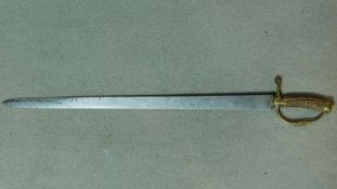 An 18th century English hanger sword, with repousse brass and deer antler handle, the 60cm blade