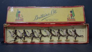 A boxed set of vintage lead figures of Zulu warriors by William Britain