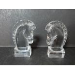 A pair of signed Art Deco Steuben crystal horses heads designed by Sidney Waugh. H12.5cm.