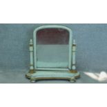 A Victorian mahogany later painted toilet mirror on platform base. H.76cm