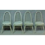 A set of four later painted vintage Ercol Windsor Quaker dining chairs with BS kitemark stamped to