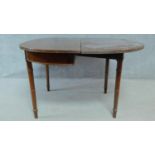 A 19th century style mahogany D end console table opening to a tea table on turned tapering