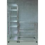 Two sets of contemporary aluminium kitchen shelving on casters. H.97 W.91 D.47cm