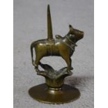 An antique Indian brass figure of the Hindu bull god Nandi. 18th-19th century. H.15 W.9cm