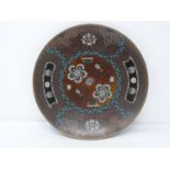 A 20th century Japanese cloisonné enamel footed plate with a stylised floral design and central