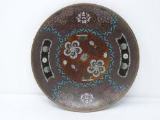 A 20th century Japanese cloisonné enamel footed plate with a stylised floral design and central