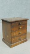 A small Victorian mahogany A. W. Gamage Ltd naturalist's chest of four graduating drawers on