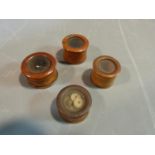 Four antique treen boxwood glass window screw pots. Some with hand written labels to base. largest