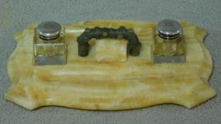 An Art Deco carved marble and bronze inkwell. With a painted branch form bronze carrying handle