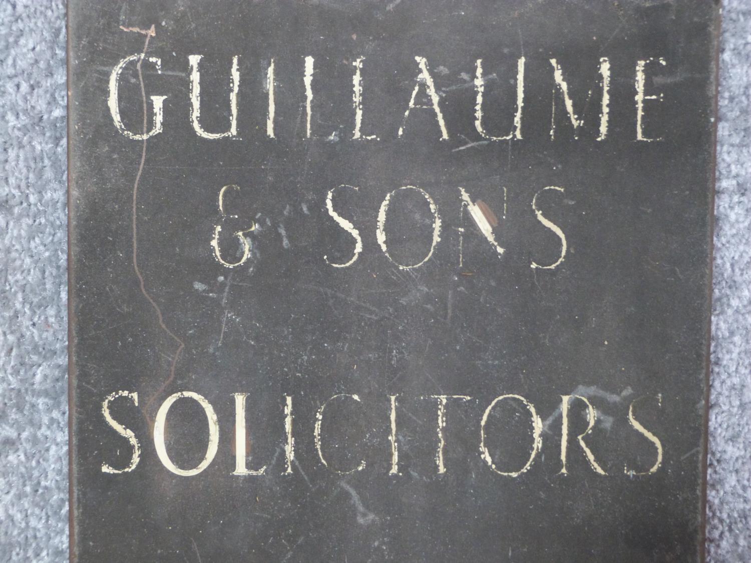 An antique brass and enamel advertising sign. The white enamel letters read 'GUILLAUME & SONS, - Image 3 of 4