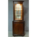 A Georgian style mahogany corner cabinet. H.181 W.67 D.45cm