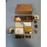 A collection of antique brass small clock and watch mechanisms along with a collection of antique