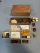 A collection of antique brass small clock and watch mechanisms along with a collection of antique