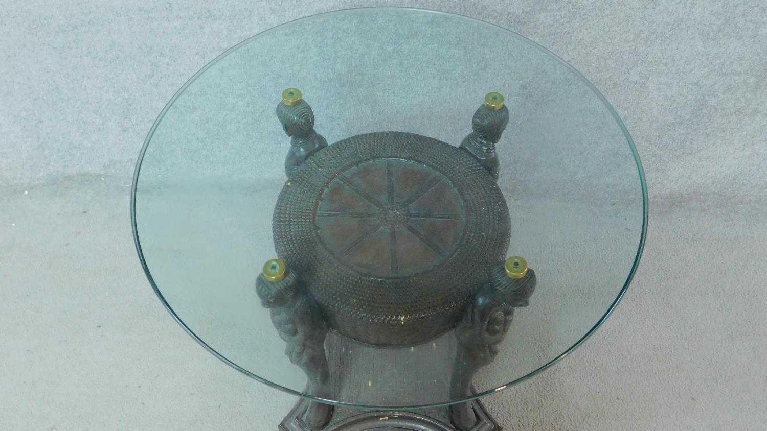 An Anglo African rattan glass top coffee table on figural supports. H.68 L.72 W.72cm - Image 2 of 4
