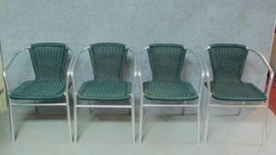 A set of four contemporary chrome framed wicker garden chairs. H.72cm