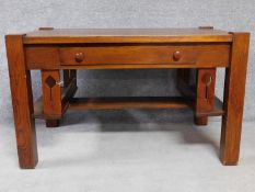 An American Arts and Crafts Mission style oak desk. Fitted with central frieze draw with book