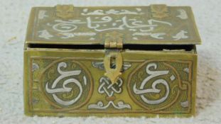An antique Cairoware box with wooden interior and decorated with Egyptian writing and scrolling