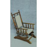 A 19th century American style turned beech child's rocking armchair. H.73cm