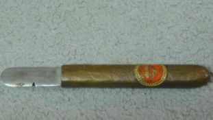 A cigar cutter in the shape of a Corona Junior Havana cigar. W.15cm