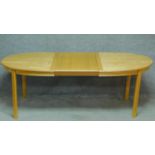 A contemporary birch extending dining table on square legs. (Includes one leaf). H.73 W.207 D.98cm