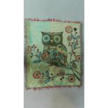 An embroidered throw with an owl on a branch with tassled edging. 150x125cm