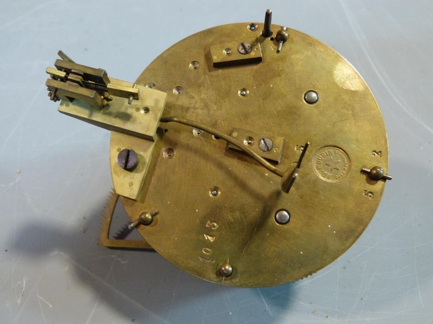 A collection of antique brass clock and watch mechnisms including strikers,bells, barrells and other - Image 10 of 14