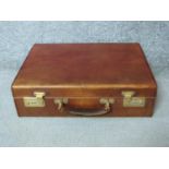 A vintage tan hide Harrods documents attaché case. With a pale suede interior and expanding