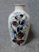 A vintage Russian handpainted and gilded bird and flower design porcelain vase by Polonne. Makers
