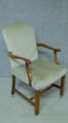 A mid 20th century Georgian style beech framed armchair in jade upholstery on square stretchered