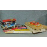 A collection of vintage board games and puzzles to include 'Snakes and ladders' and 'Crossfire'.