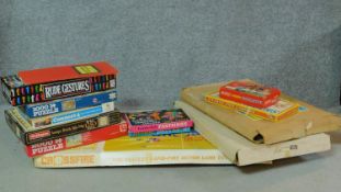 A collection of vintage board games and puzzles to include 'Snakes and ladders' and 'Crossfire'.