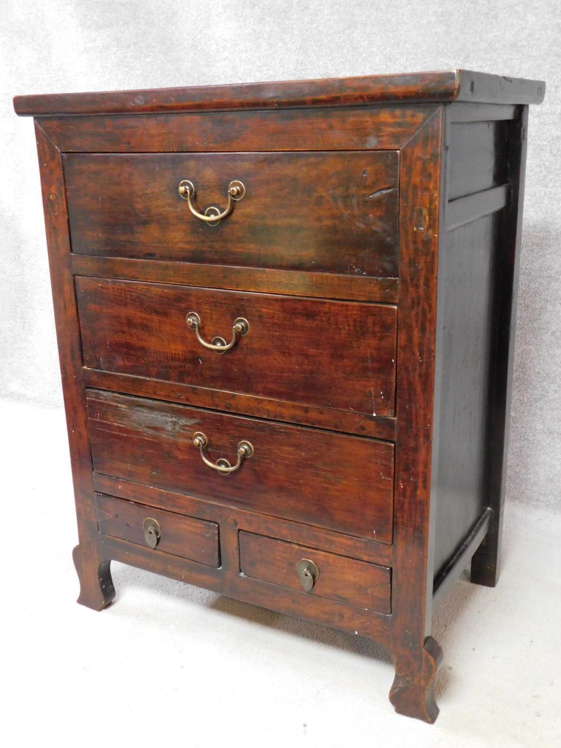 An Eastern hardwood chest with an arrangement of five drawers on cabriole supports. H.113 W.87 D. - Image 2 of 5