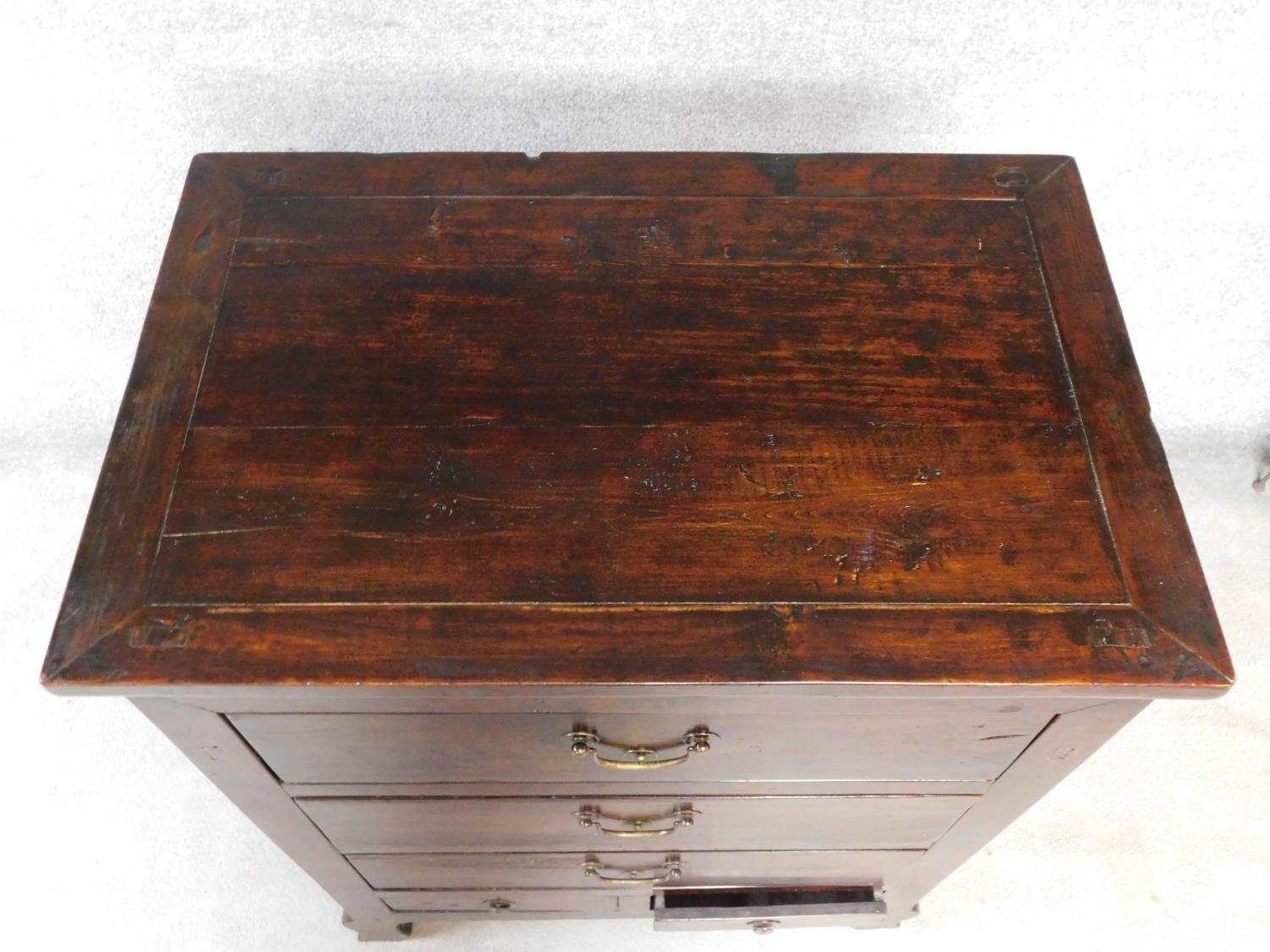 An Eastern hardwood chest with an arrangement of five drawers on cabriole supports. H.113 W.87 D. - Image 4 of 5