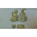 A pair of Victorian Punch and Judy brass door stops along with a repousse brass Christmas scene