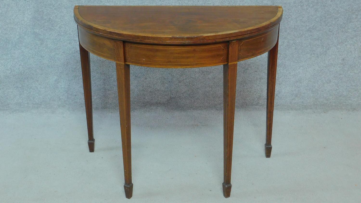 An Georgian mahogany and satinwood inlaid demi lune foldover top tea table on square tapering - Image 3 of 5