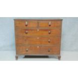 A Georgian mahogany chest of two short over three long drawers fitted with ivory escutcheons on