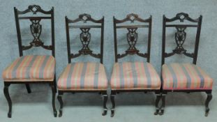 A set of three Edwardian style nursing chairs with carved back and shot silk candy stripe