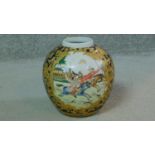 A 20th century Qianlong style hand painted and gilded vase. Decorated with a hunting scene. Qianlong