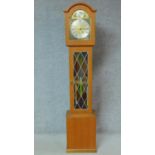 A vintage Danish teak Pallesgard grandfather clock with repousse brass dial with makers medallion '