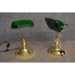 A pair of banker's desk lamps with green glass shades on brass bases. H.40cm