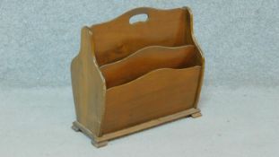 An Edwardian mahogany four division magazine rack. H.40 W.43 D.21cm