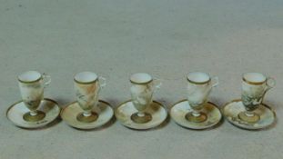 Five antique Japanese egg shell porcelain hand painted tall stemmed cups and saucers. Each one