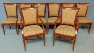 A set of eight lacquered Empire style dining chairs, to include two carver chairs H.96cm