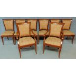 A set of eight lacquered Empire style dining chairs, to include two carver chairs H.96cm