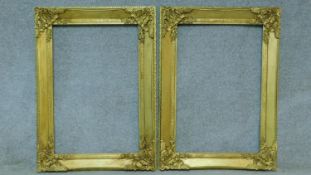 A pair of floral decorated giltwood and gesso picture or mirror frames.115x84cm