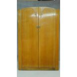 A mid 20th century light oak Art Deco style wardrobe. H.189 W.122 D.47cm