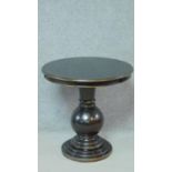A lacquered ebonised and gilt circular pedestal occasional table on stepped base. H.66 W.66 D.66cm